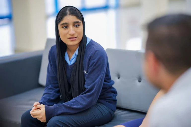 Student taking part in a one-to-one school discussion